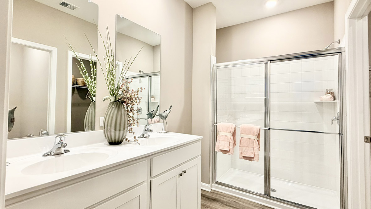 The private main suite is tucked in the back of the home and includes a large en suite bathroom.