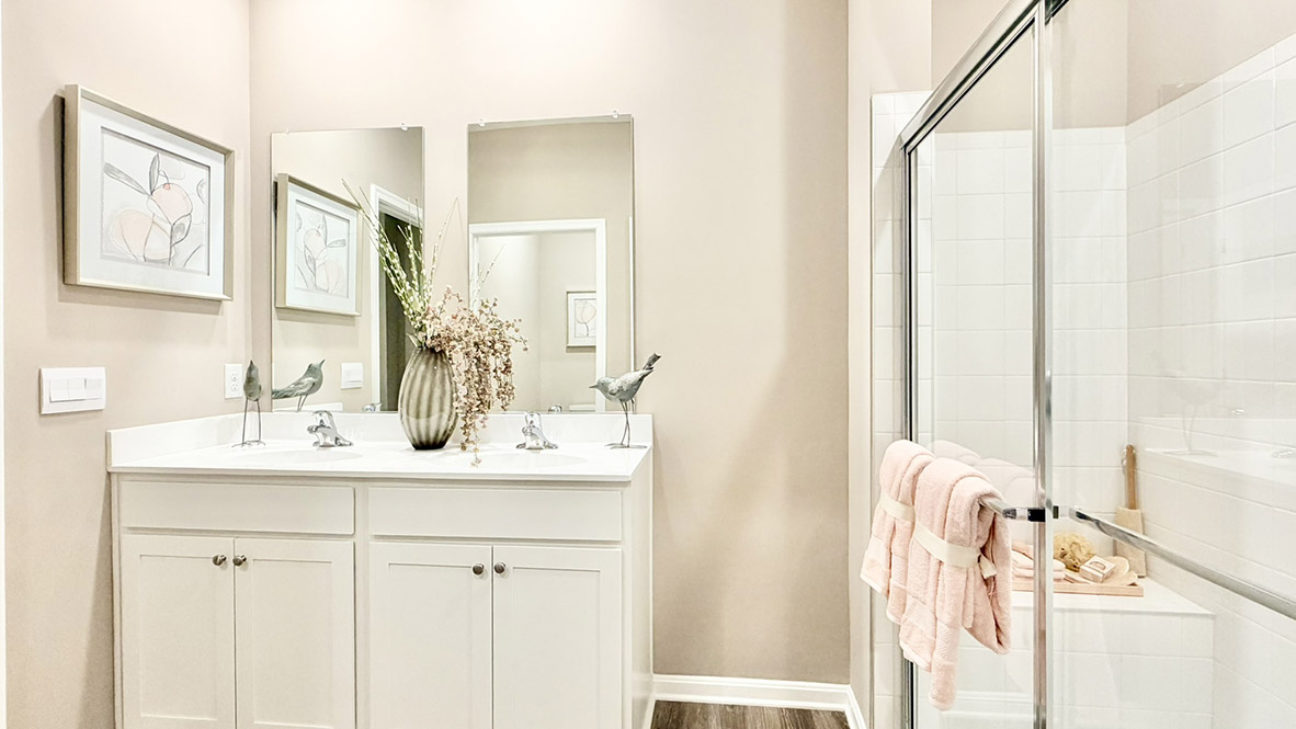 The private main suite is tucked in the back of the home and includes a large en suite bathroom.