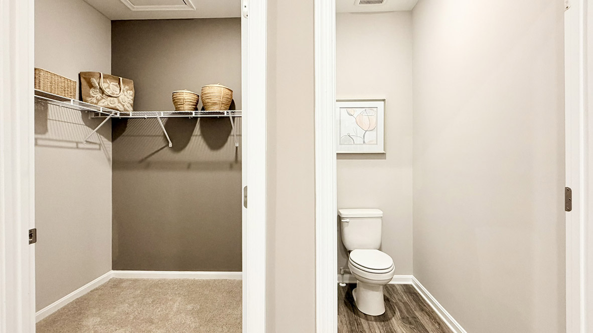 The private main suite is tucked in the back of the home and includes a large en suite bathroom.