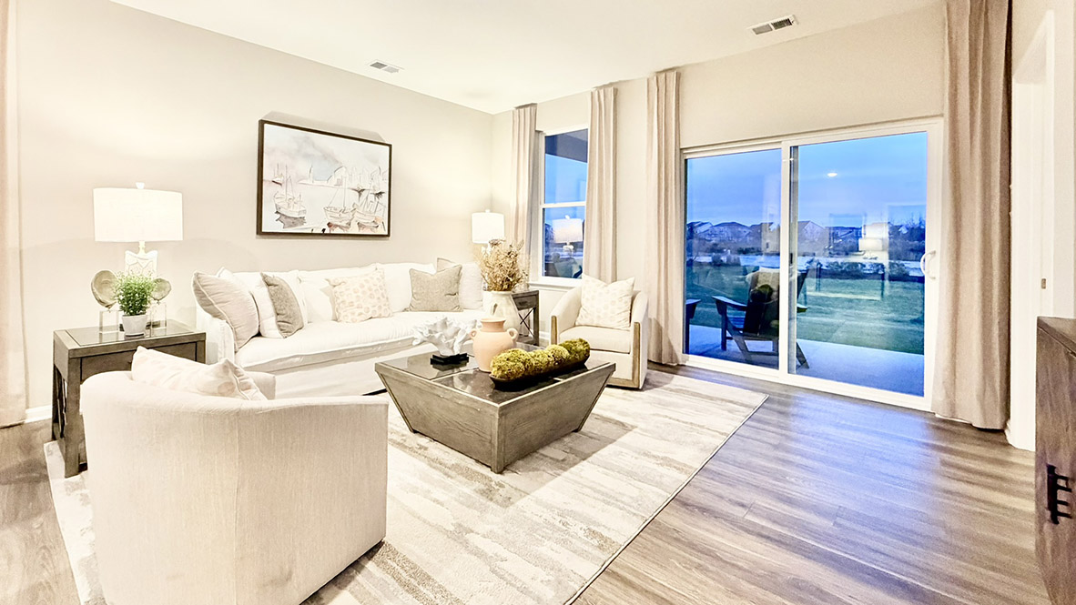 The great room provides access to the quiet covered porch at the rear of the home.
