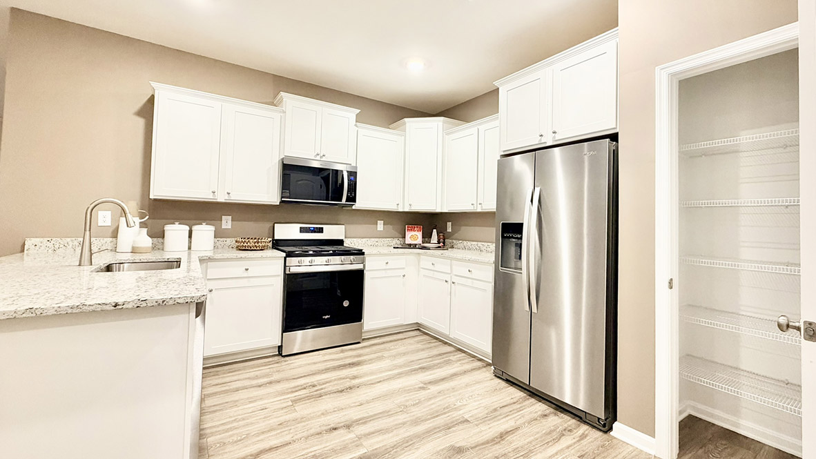 The functional kitchen has stainless steel appliances.