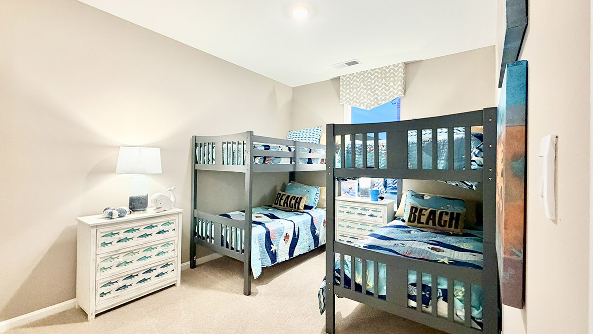 Continuing down the hall is a guest bedroom.