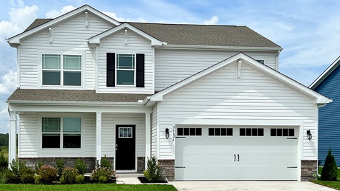 The Ellerbe is a two-story home with white siding and black shutters.