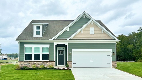 Millville by the Sea Azalea home with green siding.