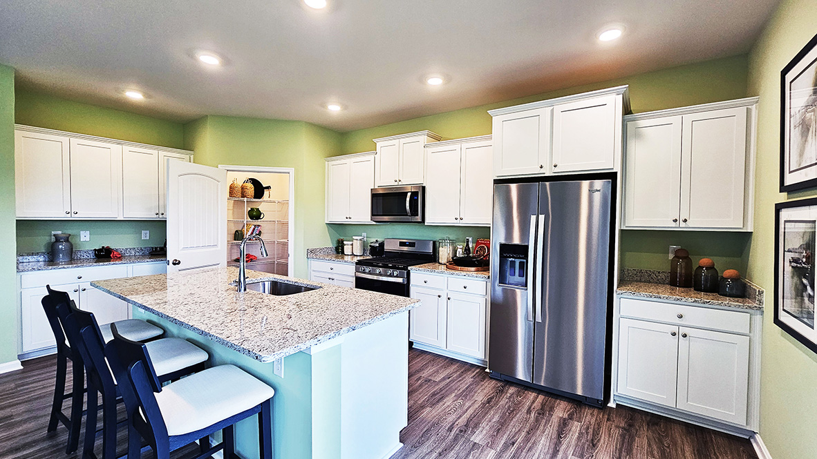 The home's well-appointed kitchen boasts a corner pantry closet.