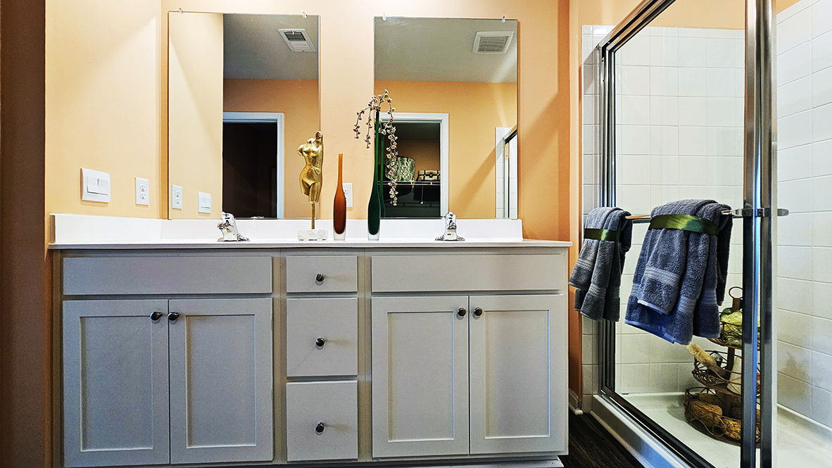 The modern bathroom has a double vanity and generously sized shower.