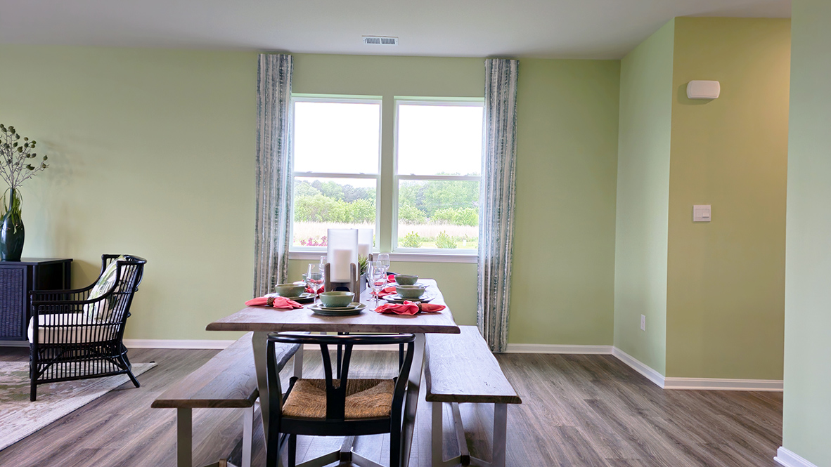 The dining area is open and allows for family and friends to gather comfortably.