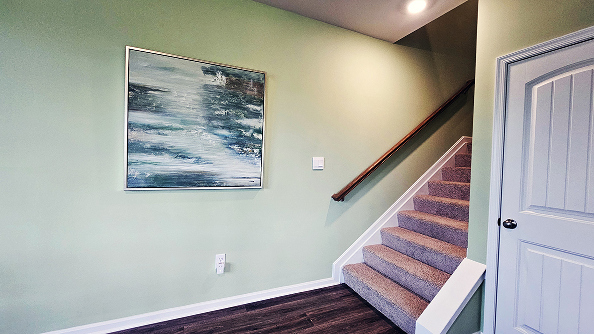 The inviting foyer offers easy access to the upstairs.