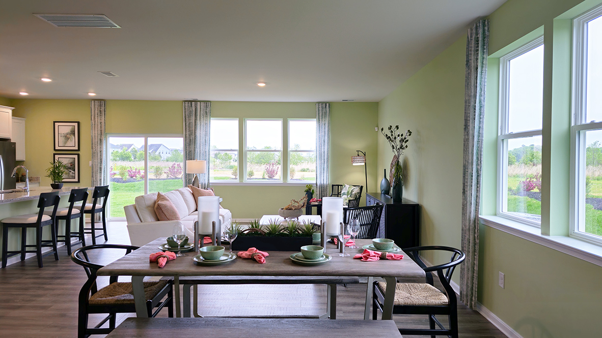 The dining area is open and allows for family and friends to gather comfortably.