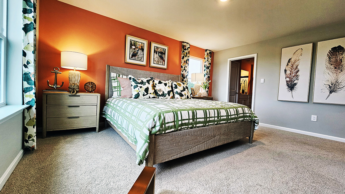 Upstairs, the large owner’s bedroom has a walk-in closet and a modern bathroom.