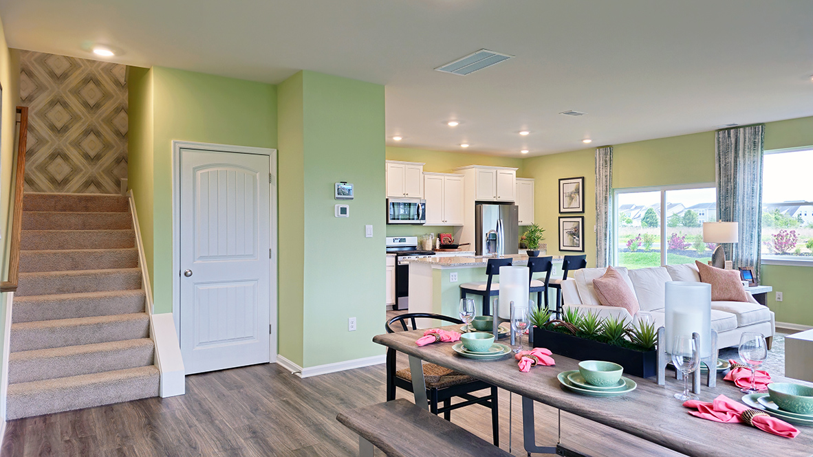 The dining area is open and allows for family and friends to gather comfortably.