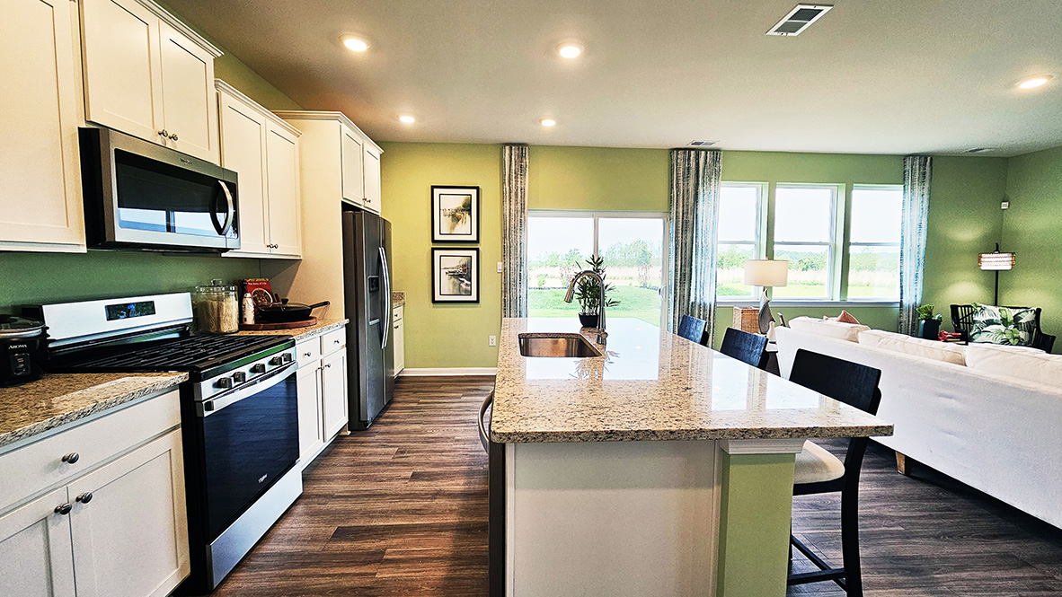 The home's well-appointed kitchen boasts substantial granite or quartz countertops.