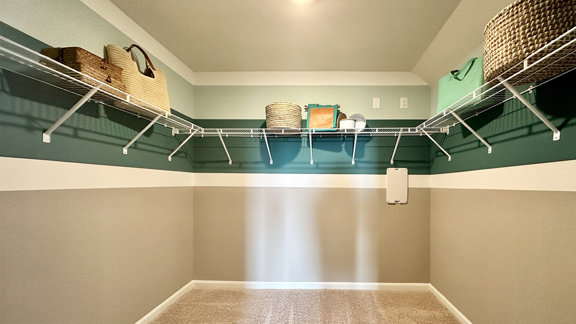 The large first-floor bedroom is a retreat in the back of the home with an oversized walk-in closet.