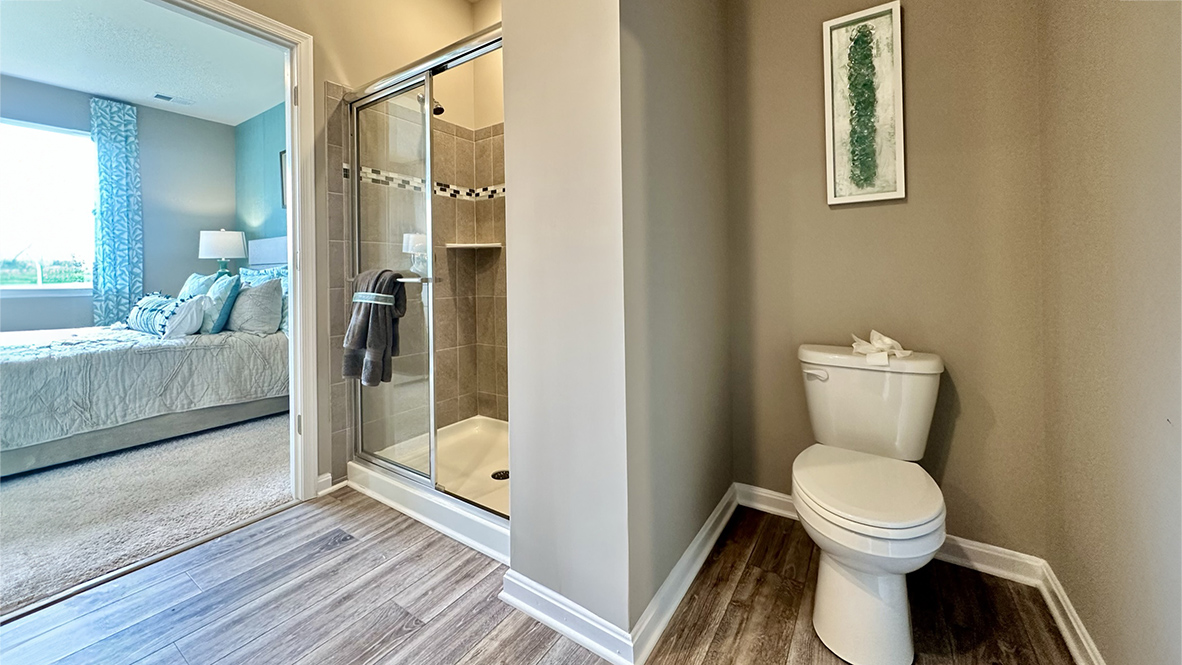 The inviting bathroom has a generously sized shower.