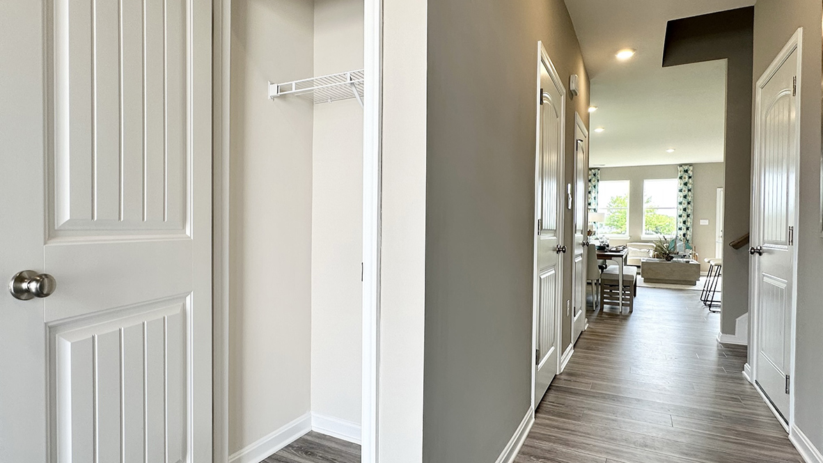 The inviting foyer features a coat closet and access to the conveniently located powder room.