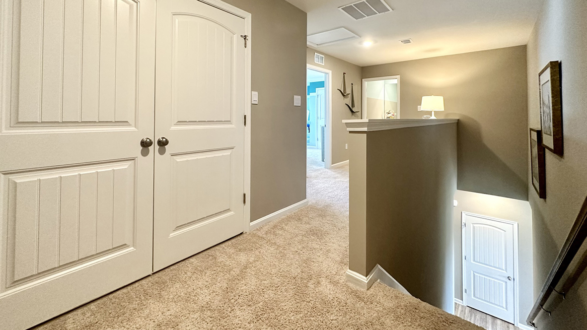 The tucked-away stairs lead you to a landing area.