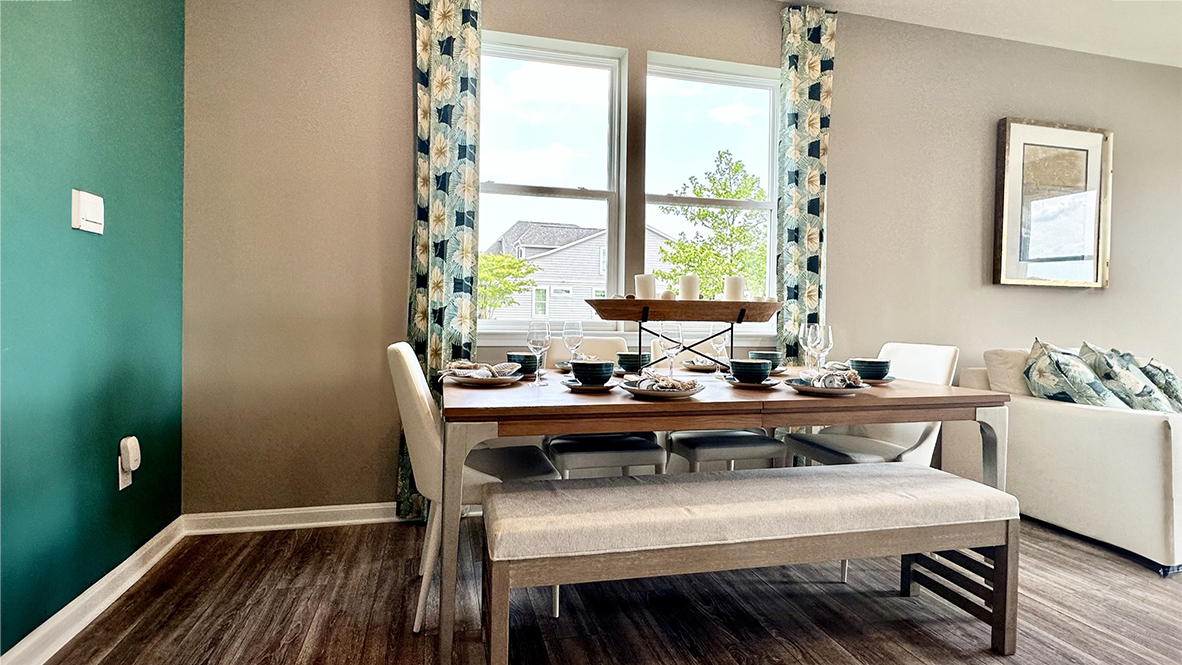 The kitchen is open to the ample great room with access to the backyard.