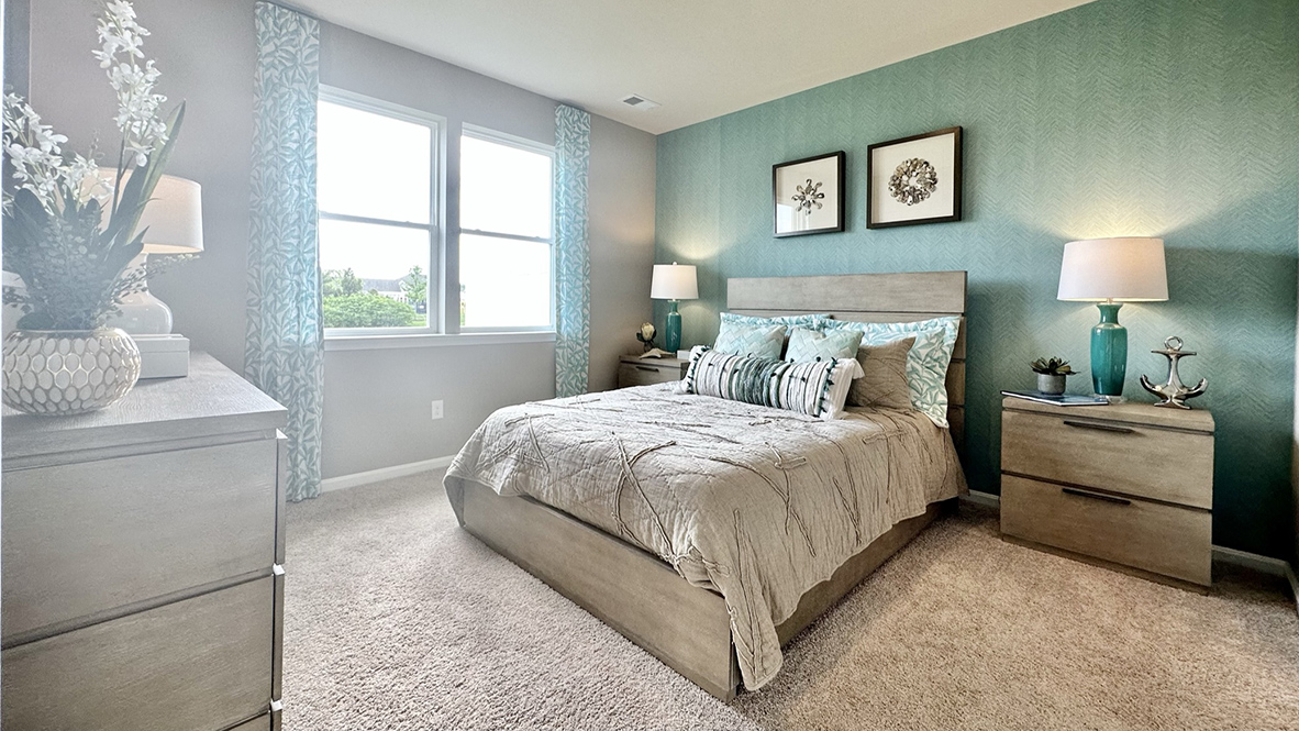 The large first-floor bedroom is a retreat in the back of the home.