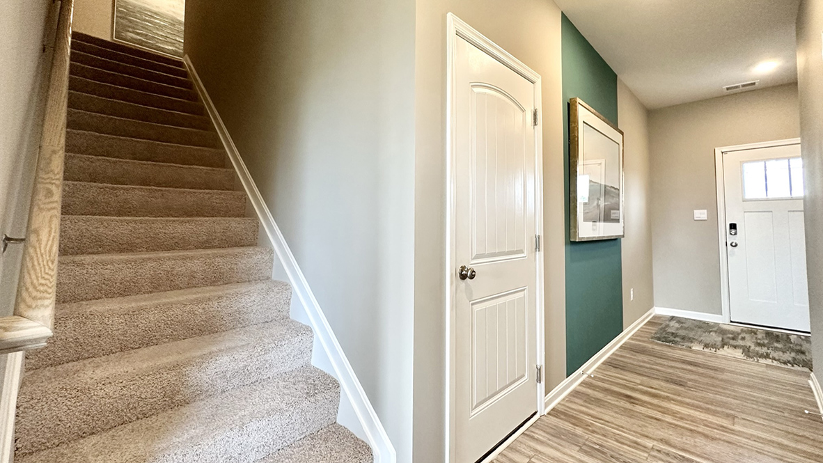 The tucked-away stairs lead you to a landing area.