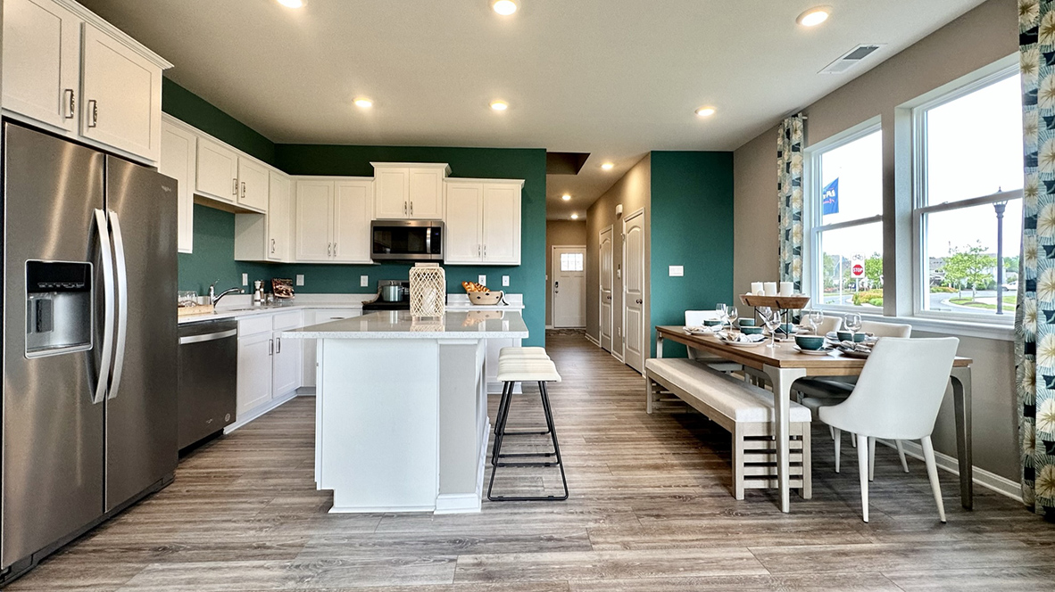 The home’s well-designed eat-in kitchen boasts stainless steel appliances.