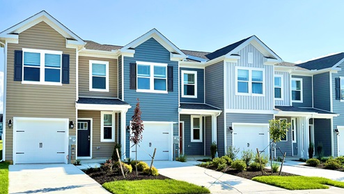 A row of Delmar townhomes with one-car garages.