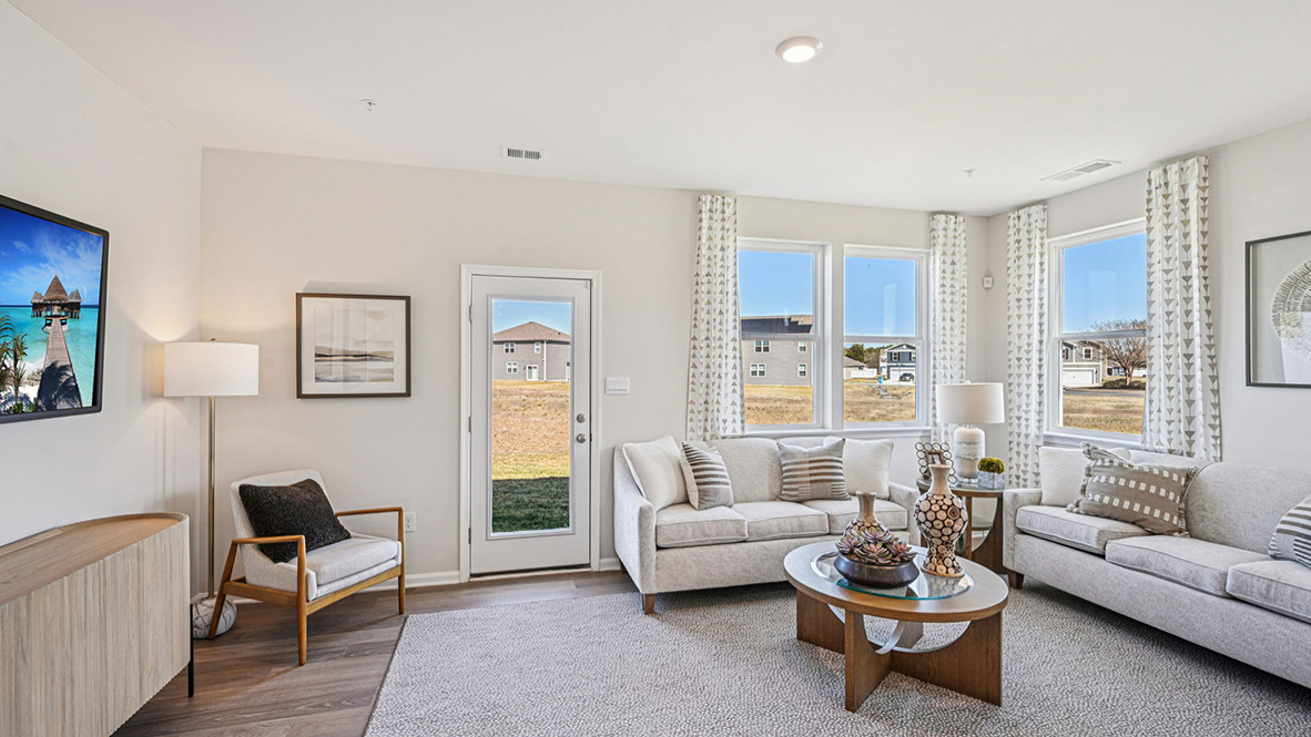 The living room gives access to the backyard.
