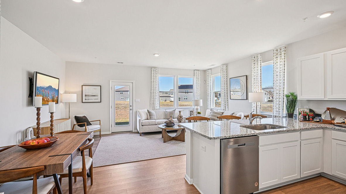The kitchen is open to the ample living room and dining area.