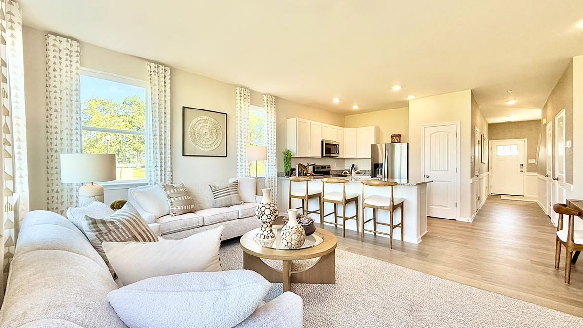 The kitchen is open to the ample living room and dining area making family gatherings effortless.