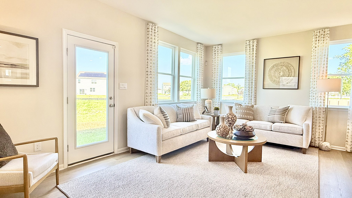 The living room gives access to the backyard.