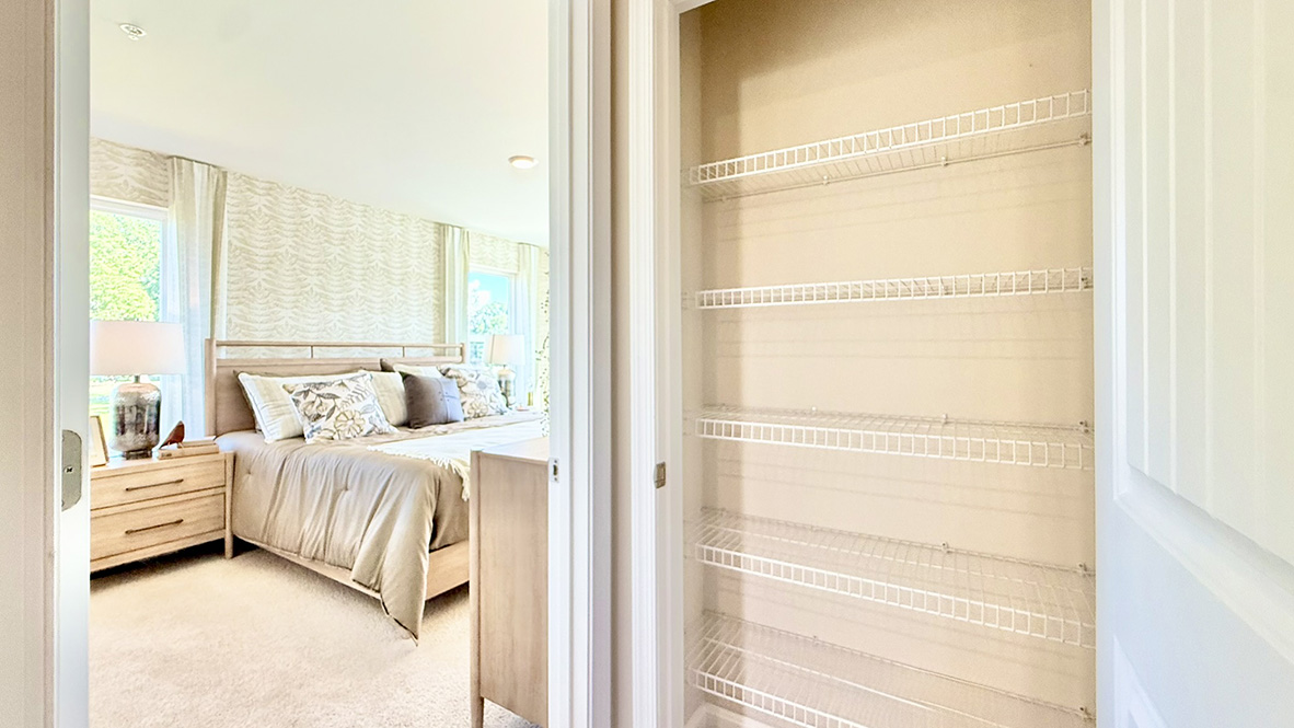 A linen closet is conveniently located in the hallway.