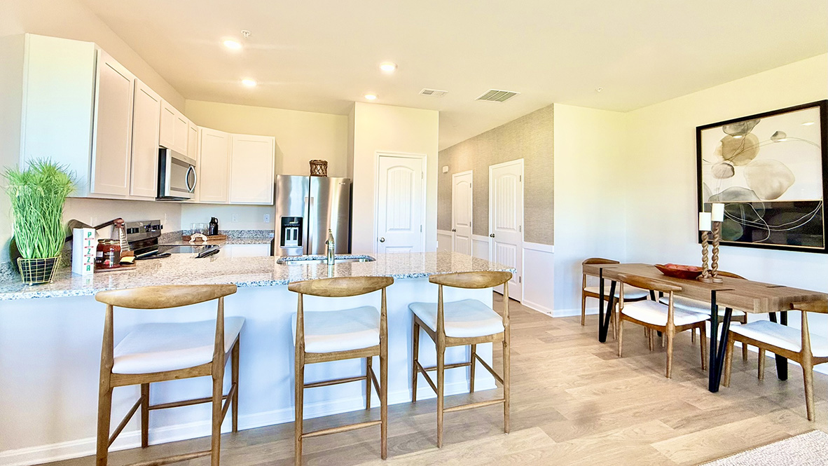 The home's functional eat-in kitchen features a spacious peninsula island with room for seating.