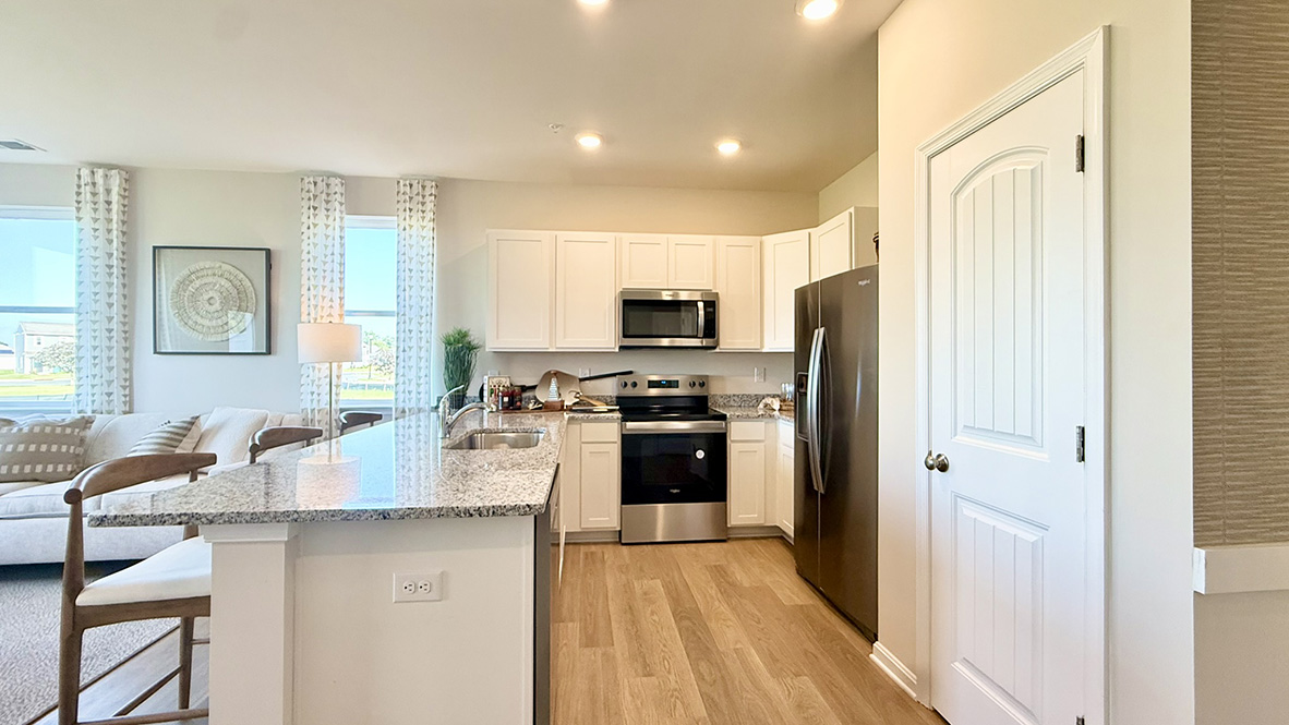 The home's functional eat-in kitchen features ample cabinet space.