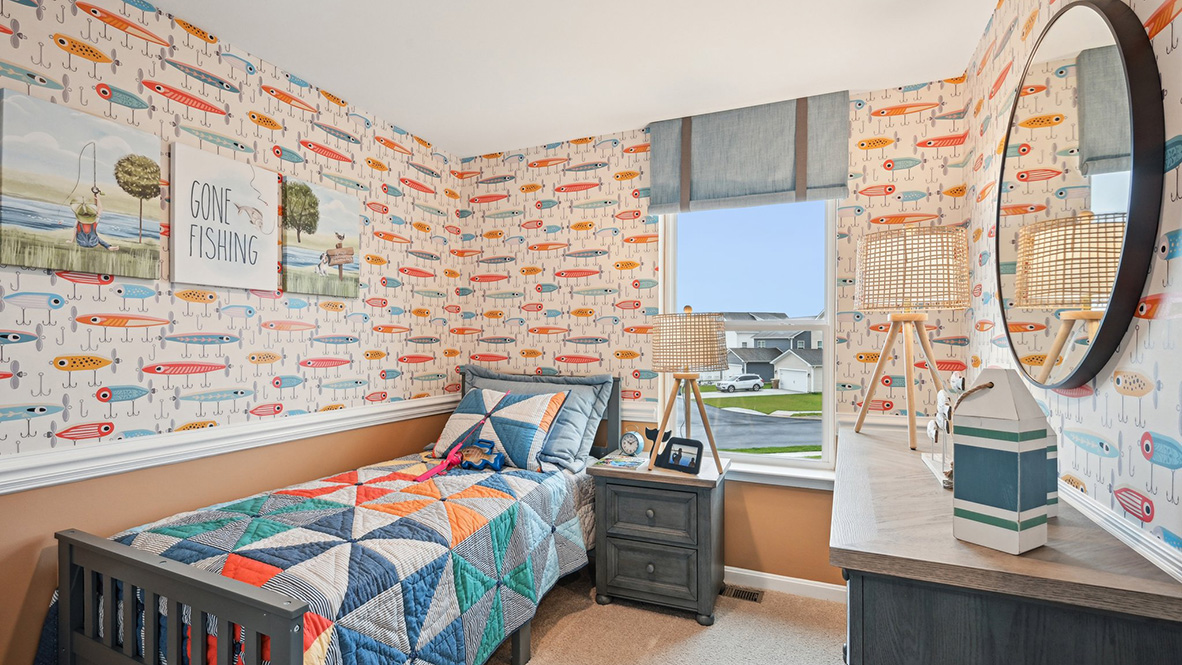Secondary bedroom with carpet throughout and window.