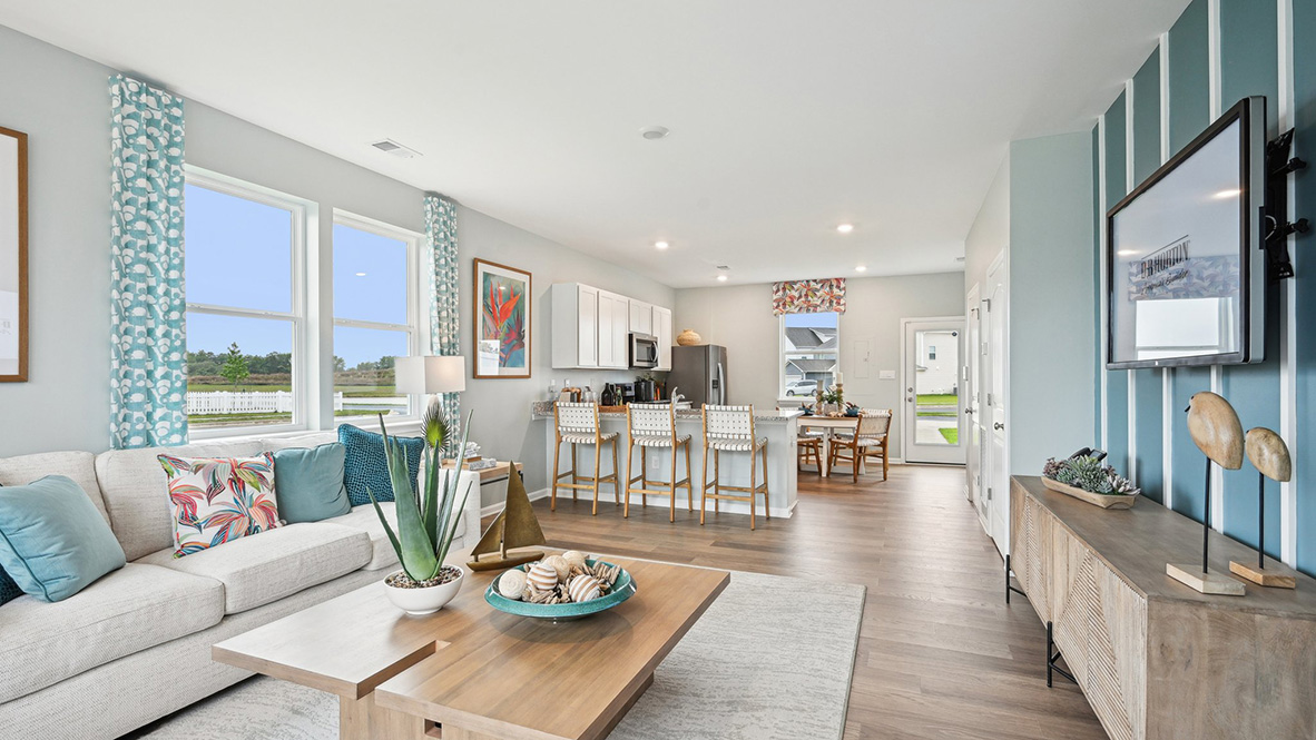 The living area flows into the kitchen and dining area.