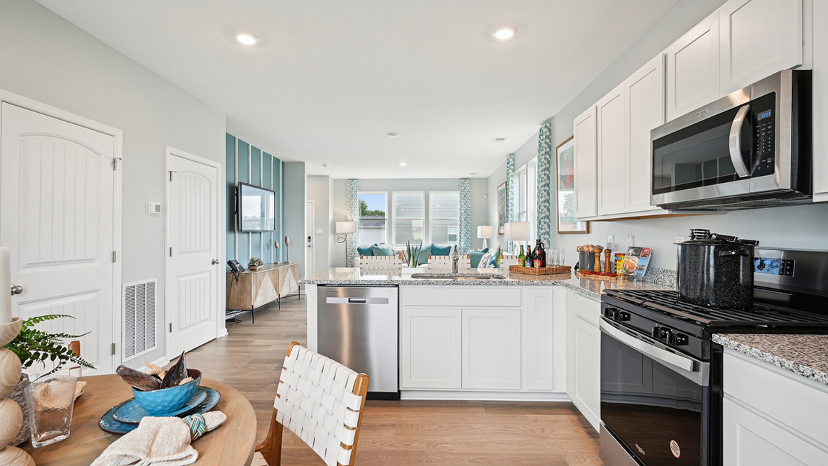 Bright kitchen with peninsula island and ample cabinets.