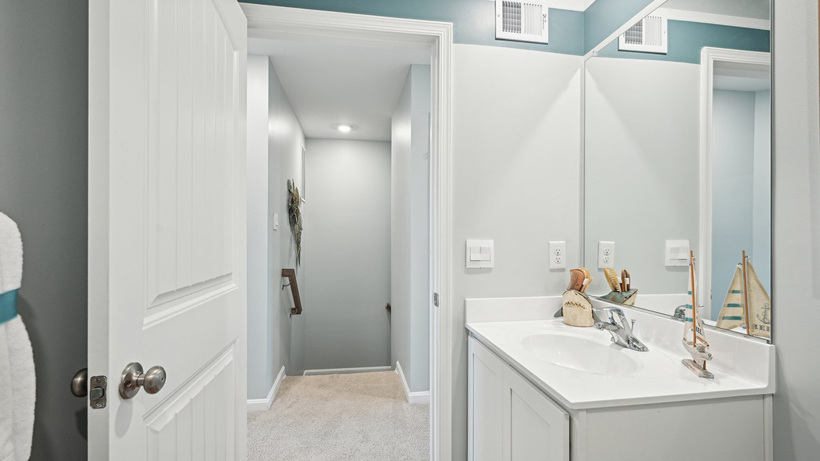 A shared secondary bathroom is located centrally to each bedroom.
