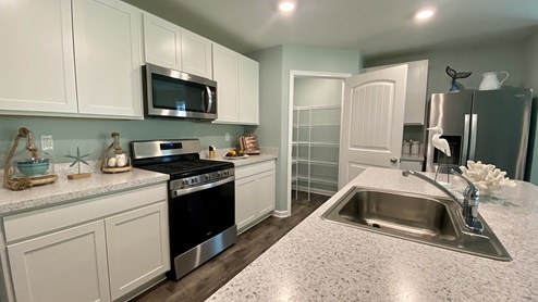 Large kitchen island with sink.