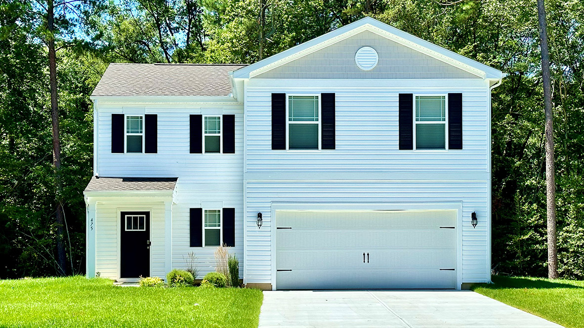 A two-story Deerfield home with white siding and black shutters.