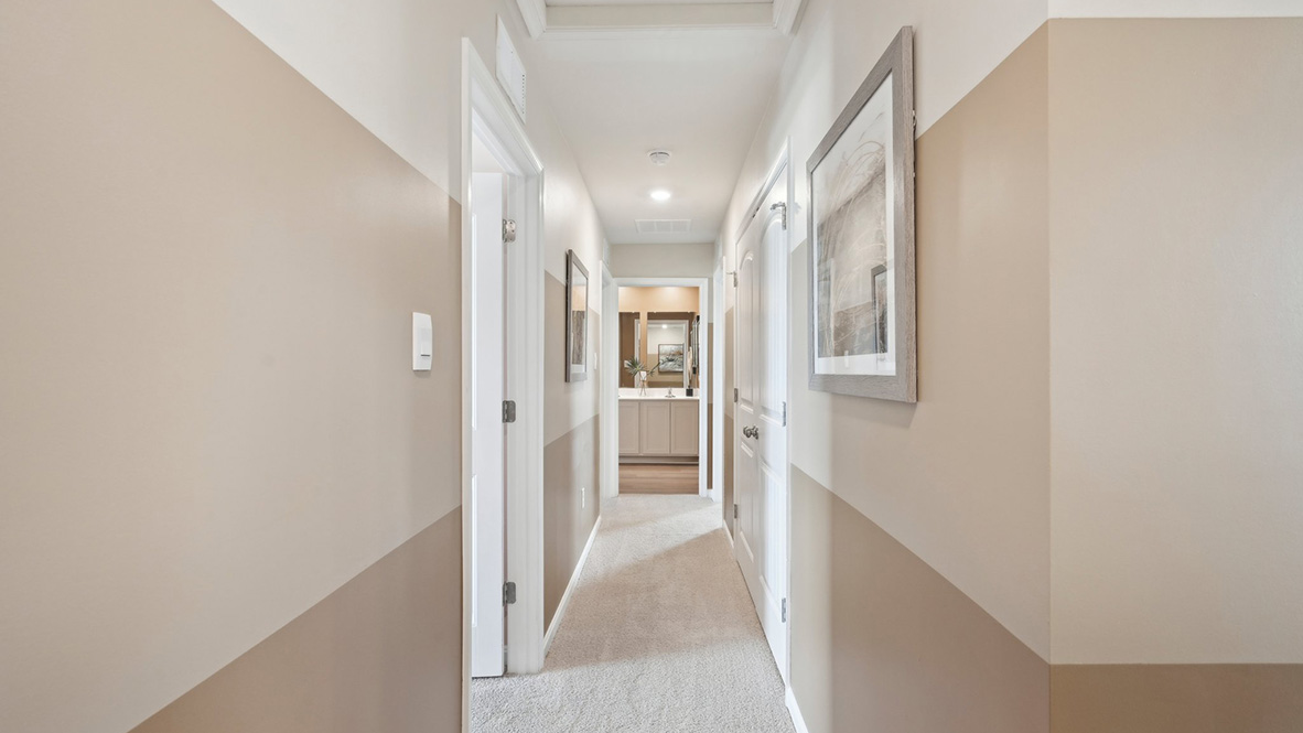 A large hallway takes you to the additional upstairs bedrooms.