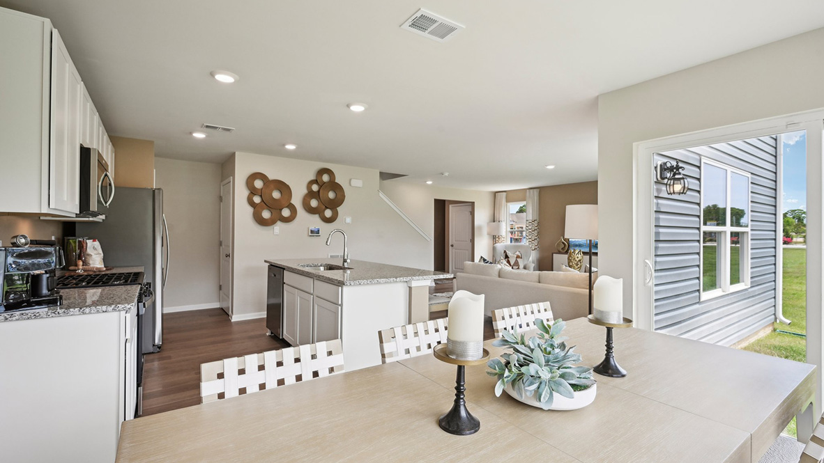 The open floorplan allows you and your loved ones to spend quality time together while in the living room, casual dining area and kitchen.