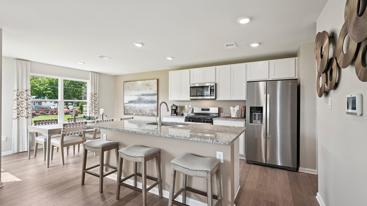 The spacious kitchen has a large island with room for seating.