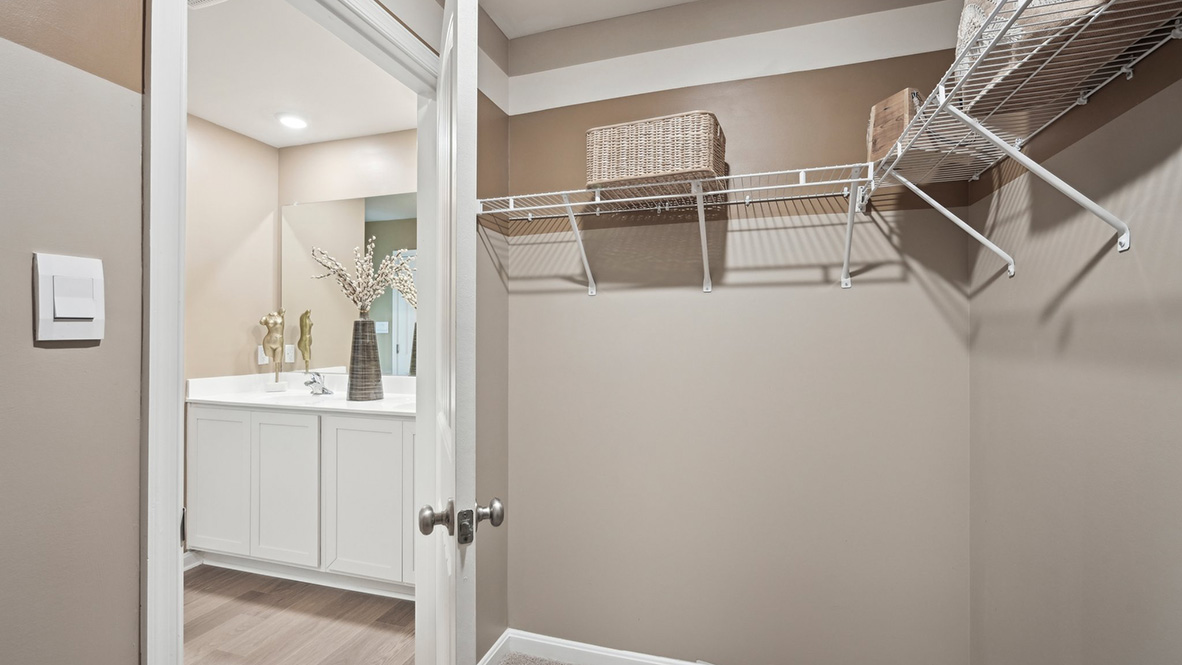 The owner's bathroom has a double-bowl vanity and two walk-in closets.