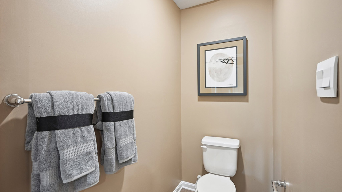 The owner's bathroom has a private toilet closet.