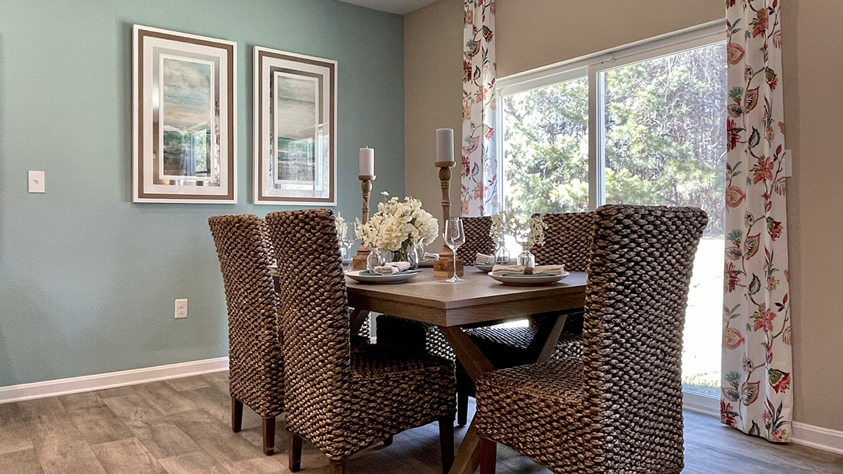 The dining area is next to the back sliding glass door.