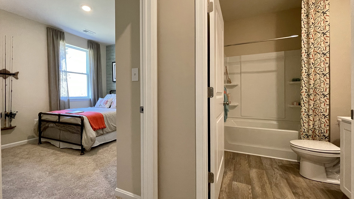 Also located on the first floor is a bedroom with a full bath in the hallway.