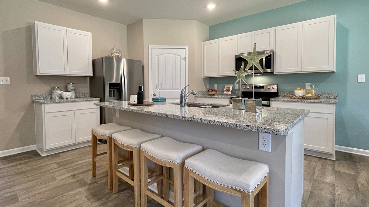 Open-concept kitchen with a large island with room for seating.