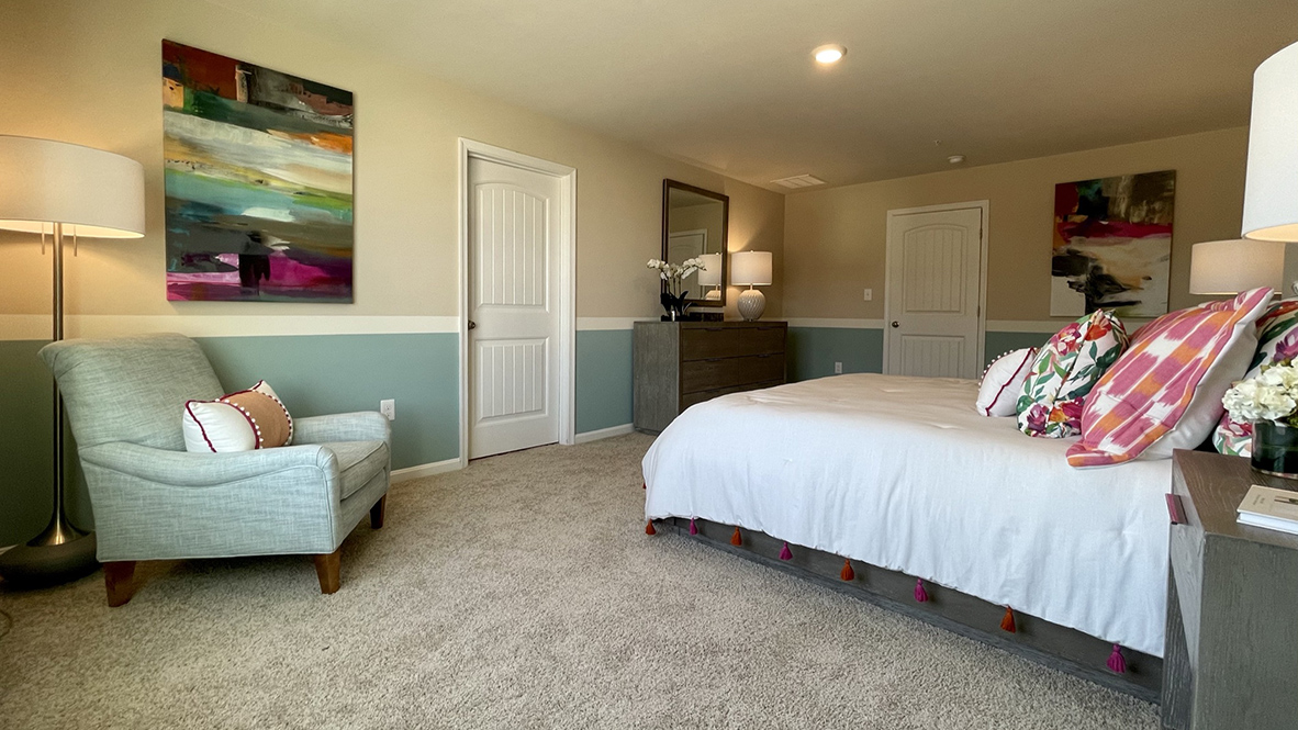 The primary bedroom is complete with a private, double bowl vanity bathroom and oversized walk-in closet.