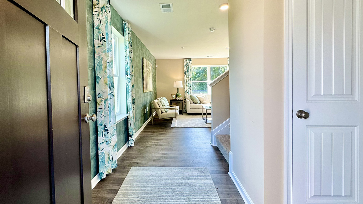 A welcoming foyer with a coat closet greets you as you enter this two-story home.