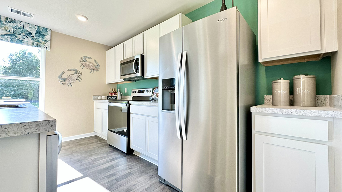 The kitchen offers sleek stainless steel appliances.
