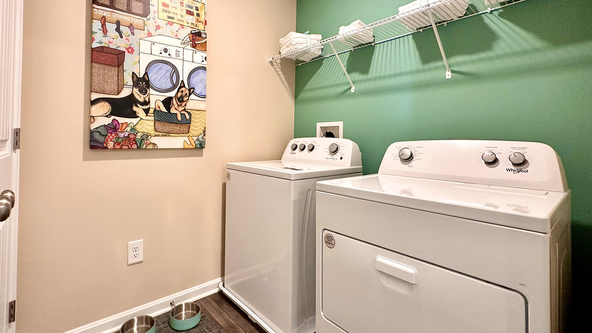 The laundry room includes a washer and dryer.
